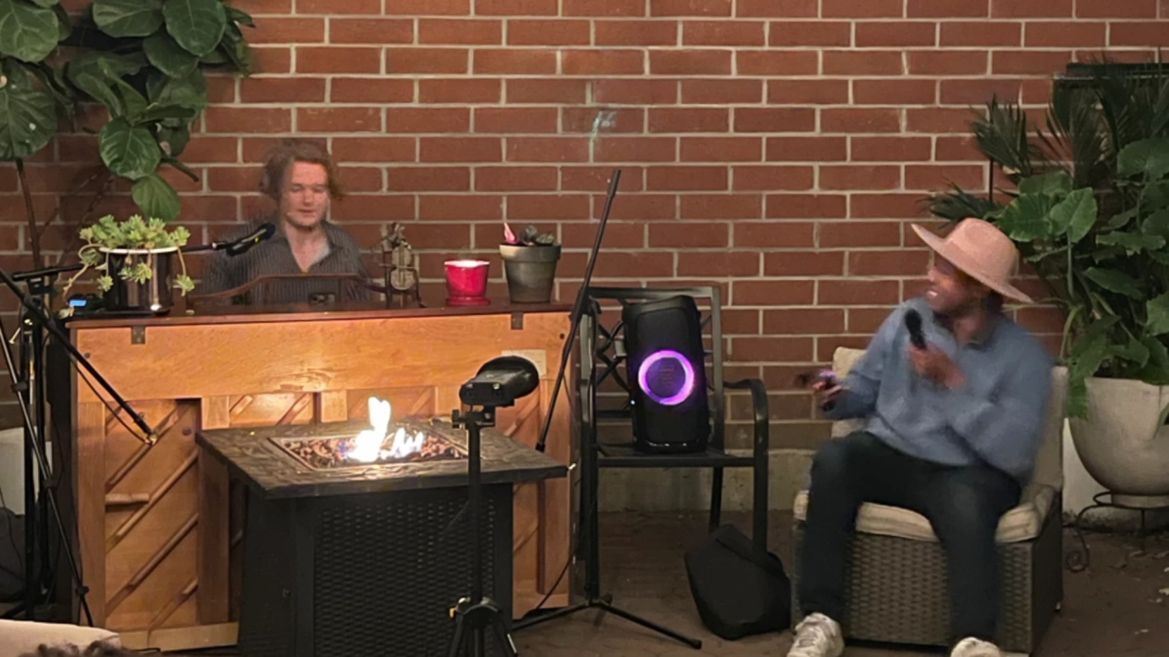 Intimate backyard concert with piano and singer